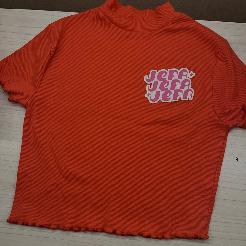 This is a size small orange turtle neck crop top